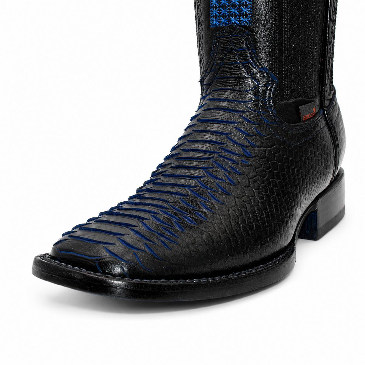 Close-up of square toe and blue embossed scale accents on H526328