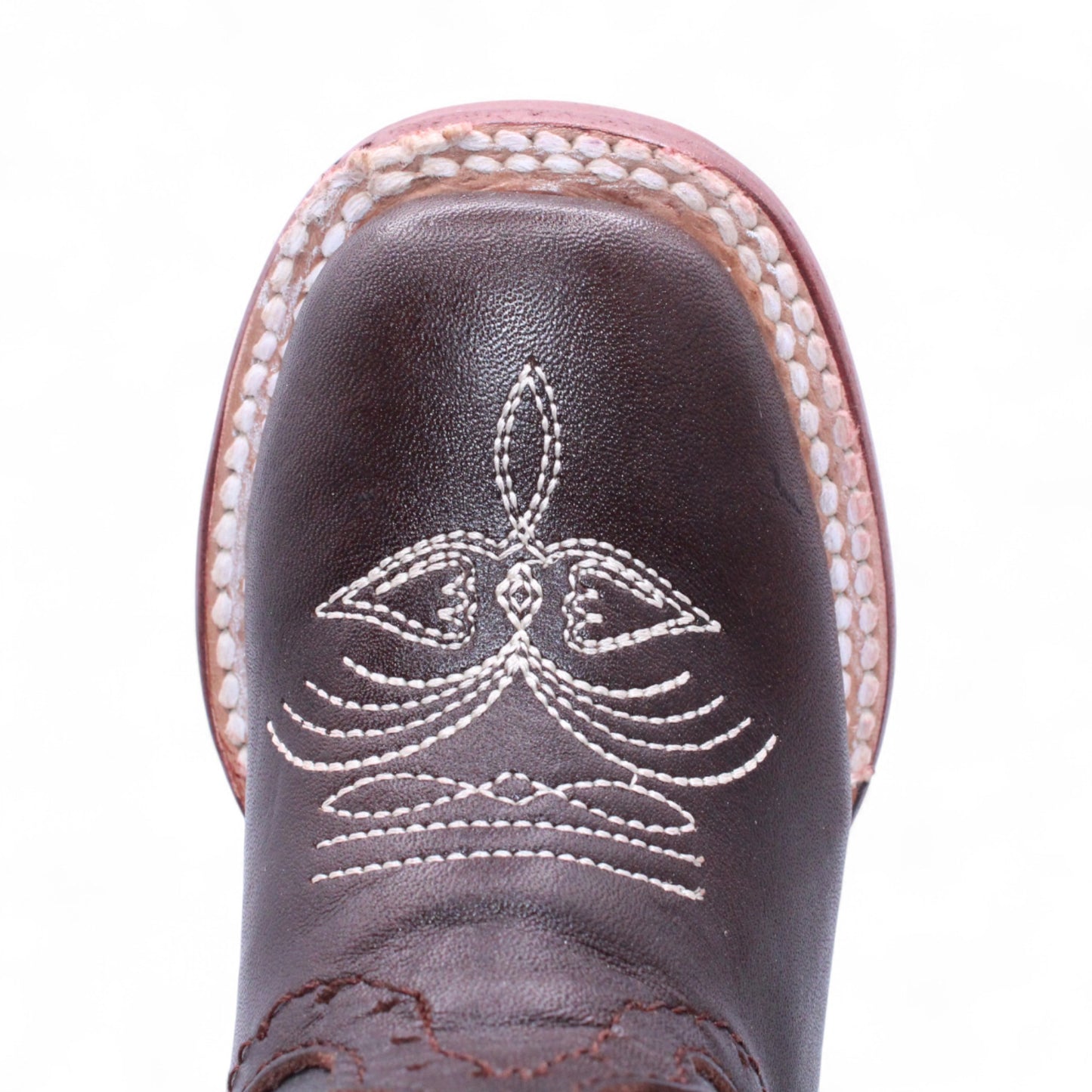 Close-up of stitched toe design on girls brown leather Western boot H329594