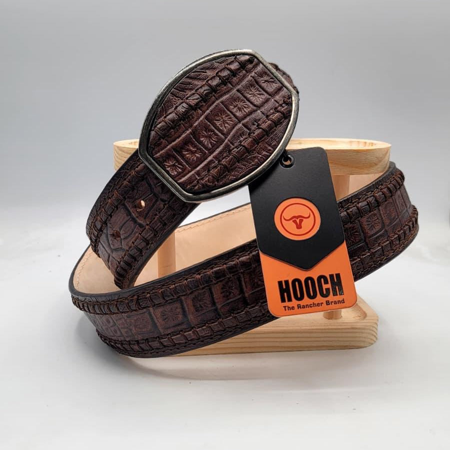 Brown leather belt with a tag labeled 'Hooch' on a gray background