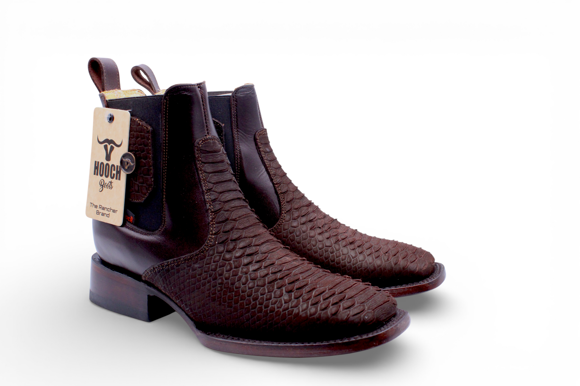 Pair of brown leather boots with a visible brand tag on a white background