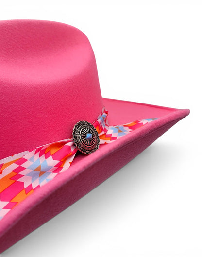 Close-up of Charlie hat band and silver-tone concho on women’s pink cowgirl hat